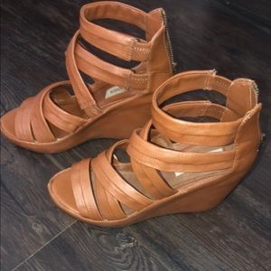 Brown wedge heels.